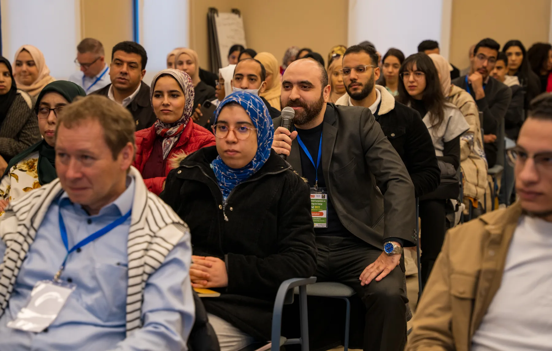 Audience following a conference presentation