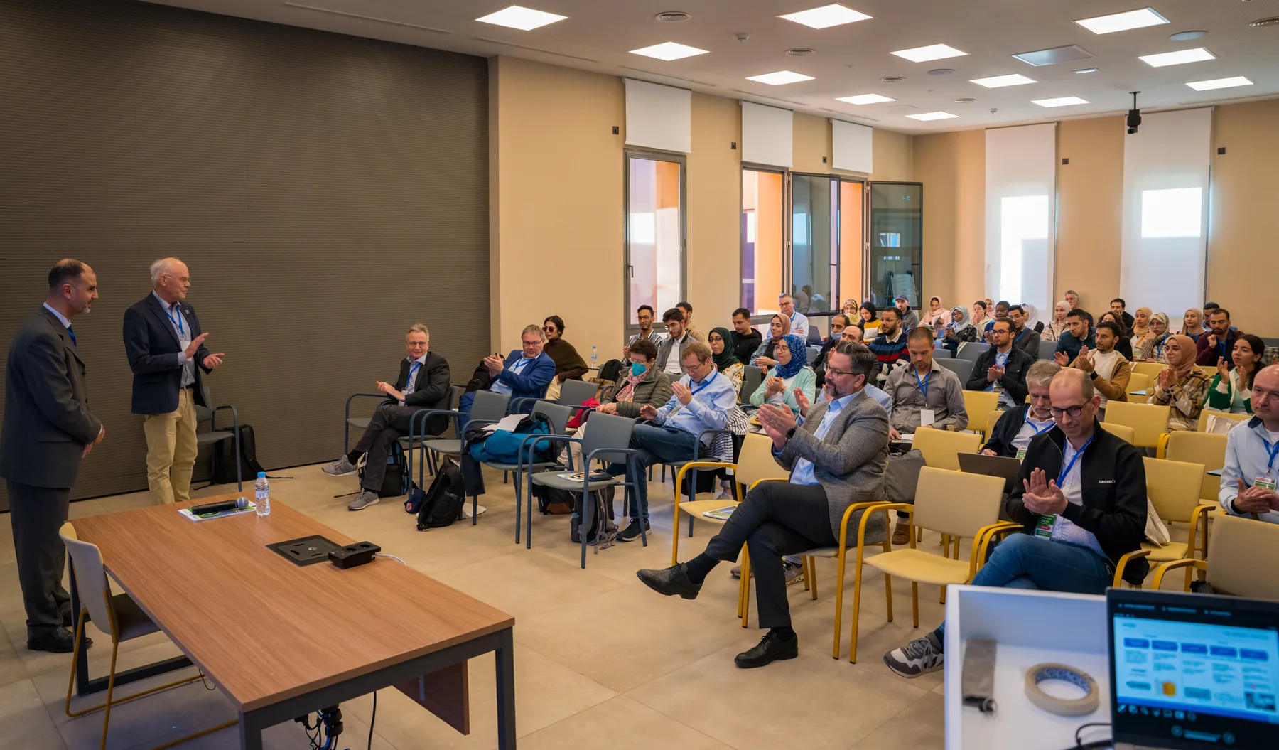 Delegates attending a plenary presentation